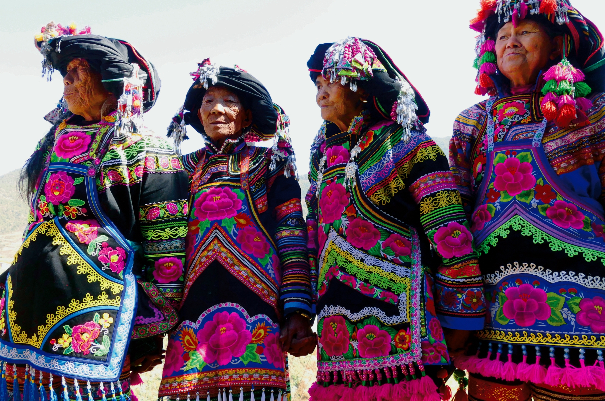 An undated photo shows women from the Yi ethnic group ready to show off their costumes during the 