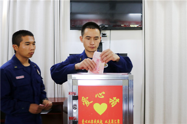 愛心捐款。木曉東攝